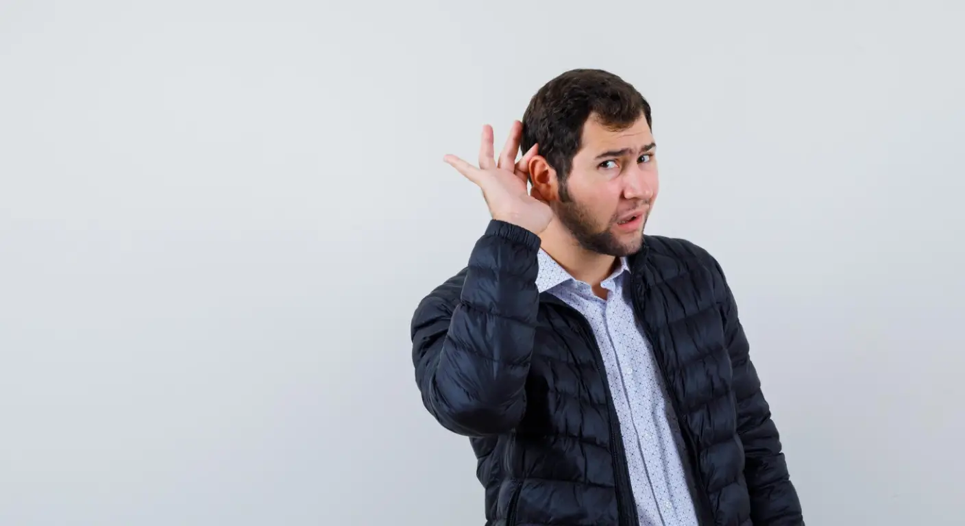 Person experiencing brief ear ringing - why does my ear randomly ring for a few seconds